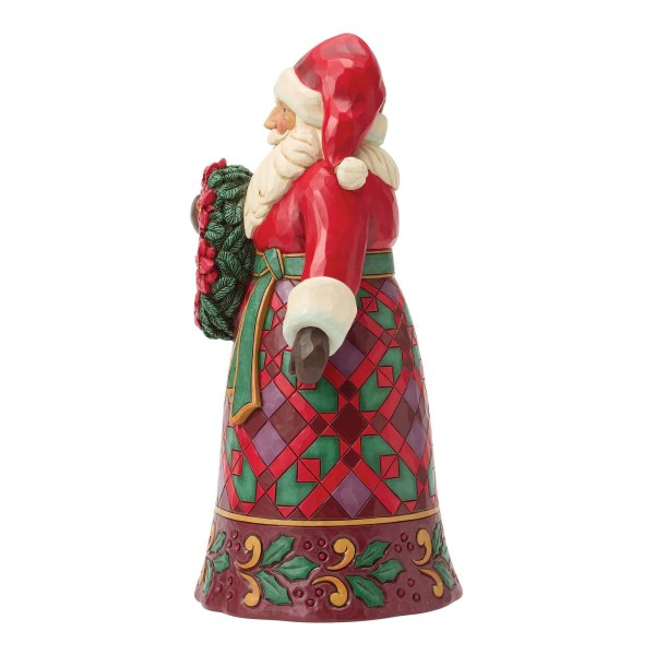 Santa with poinsettia figure - Heartwood Creek
