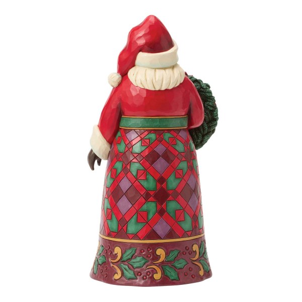 Santa with poinsettia figure - Heartwood Creek