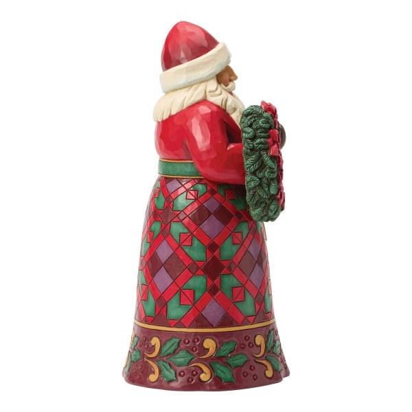 Santa with poinsettia figure - Heartwood Creek