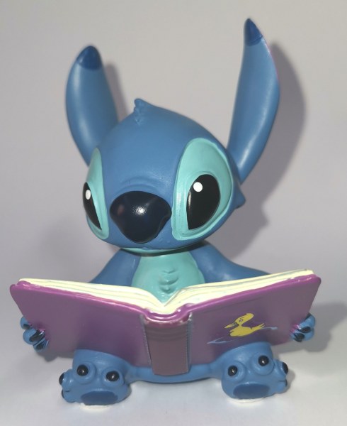MINI STITCH WITH BOOK - DISNEY SHOWCASE